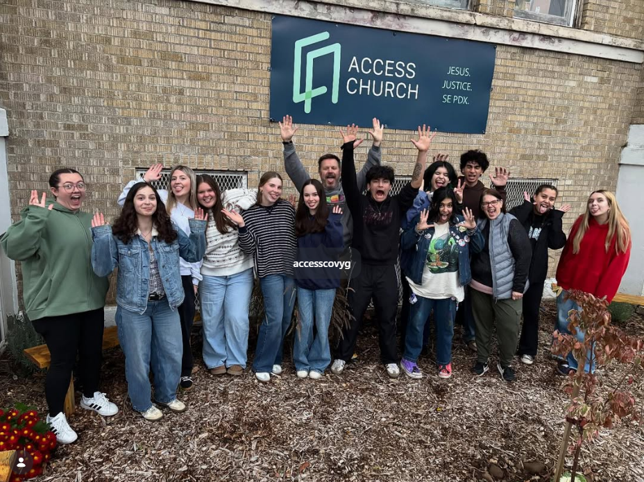 Access Covenant Church students and leaders together under the Access Church sign